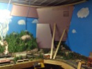 picture of a model rail layout with foam board glued to the wall behind