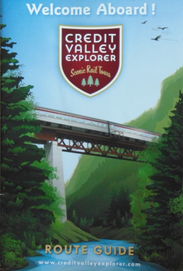 cover of brochure with picture of train crossing a wooded valley